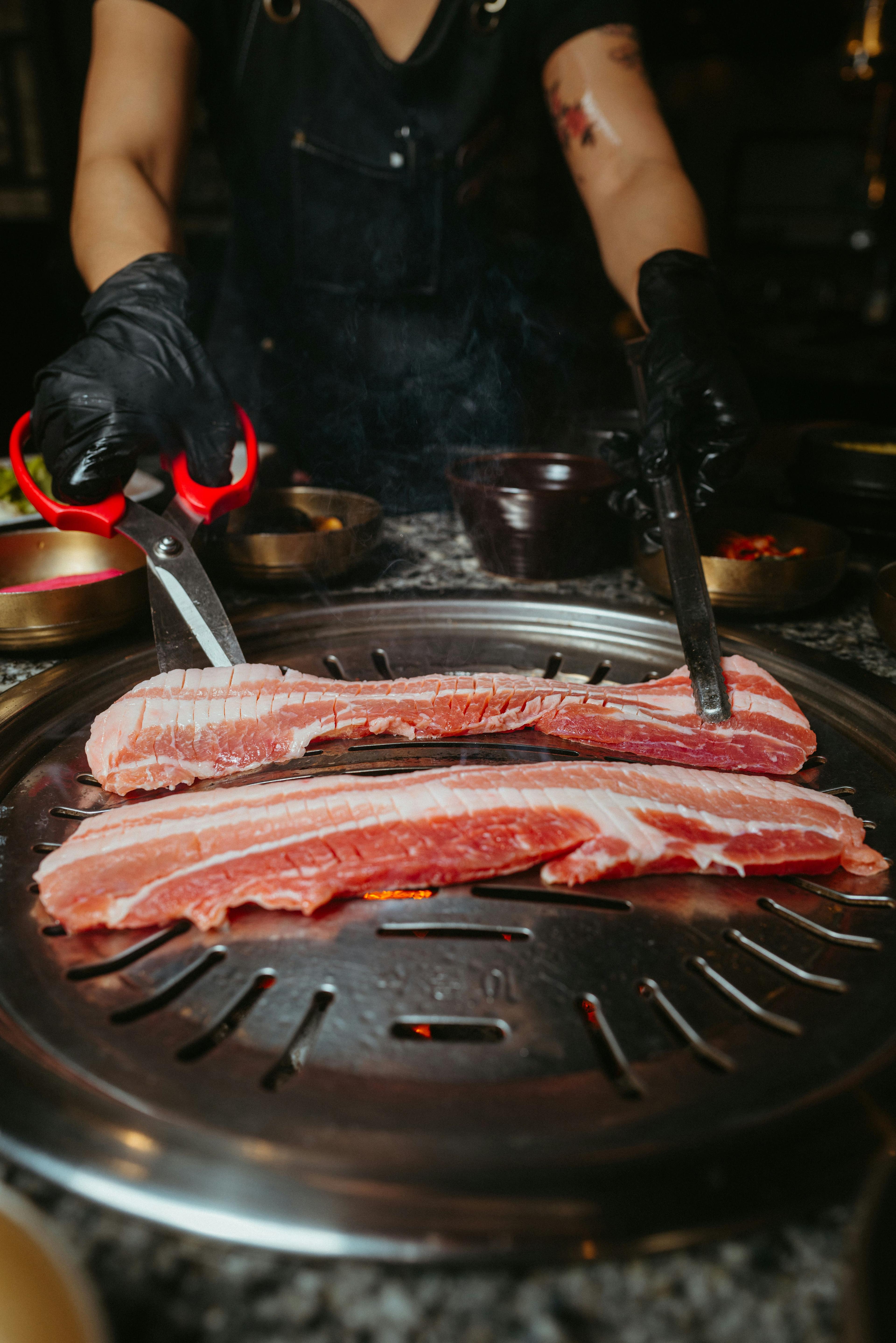 waitress grilling korean bbq